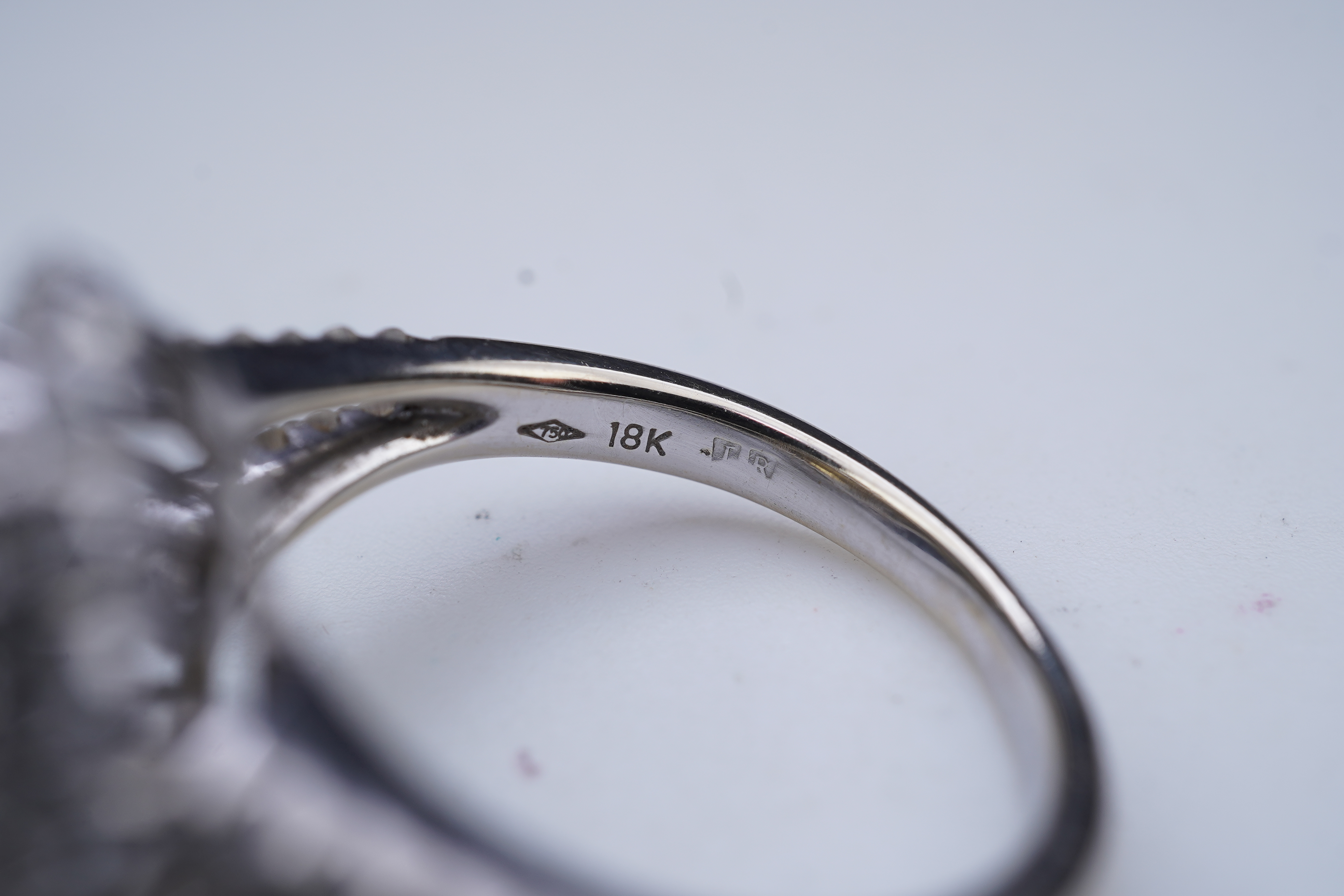 A yellow sapphire and diamond ring